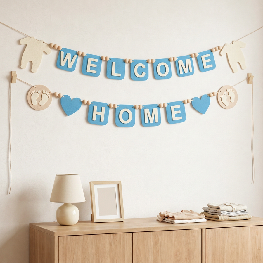 Blue WELCOME HOME felt garland displayed on a nursery wall