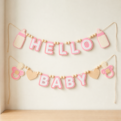 Pink HELLO BABY felt garland with baby bottle shapes, pacifiers and hearts