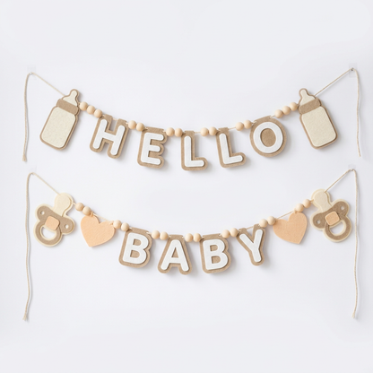 Tan HELLO BABY felt garland with baby bottle shapes, pacifiers and hearts