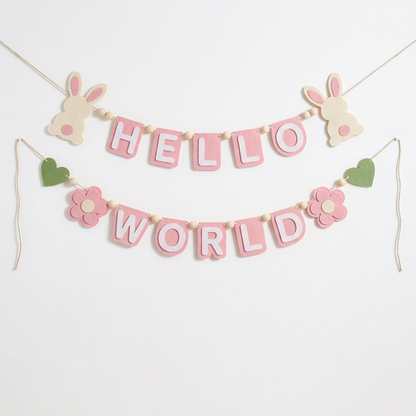 Pink HELLO WORLD felt garland with rabbits, flowers and green hearts