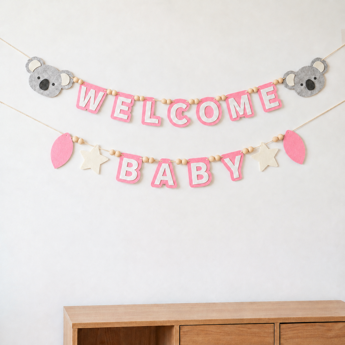 Pink WELCOME BABY felt garland with grey koalas, stars and balloons