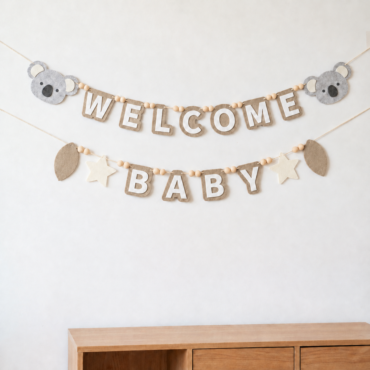 Tan WELCOME BABY felt garland with grey koalas, stars and balloons