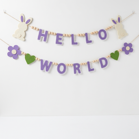 Lavender HELLO WORLD felt garland with cream rabbits, purple flowers and green hearts