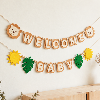 Tan WELCOME BABY felt garland with lion faces, sunshine shapes and green leaves
