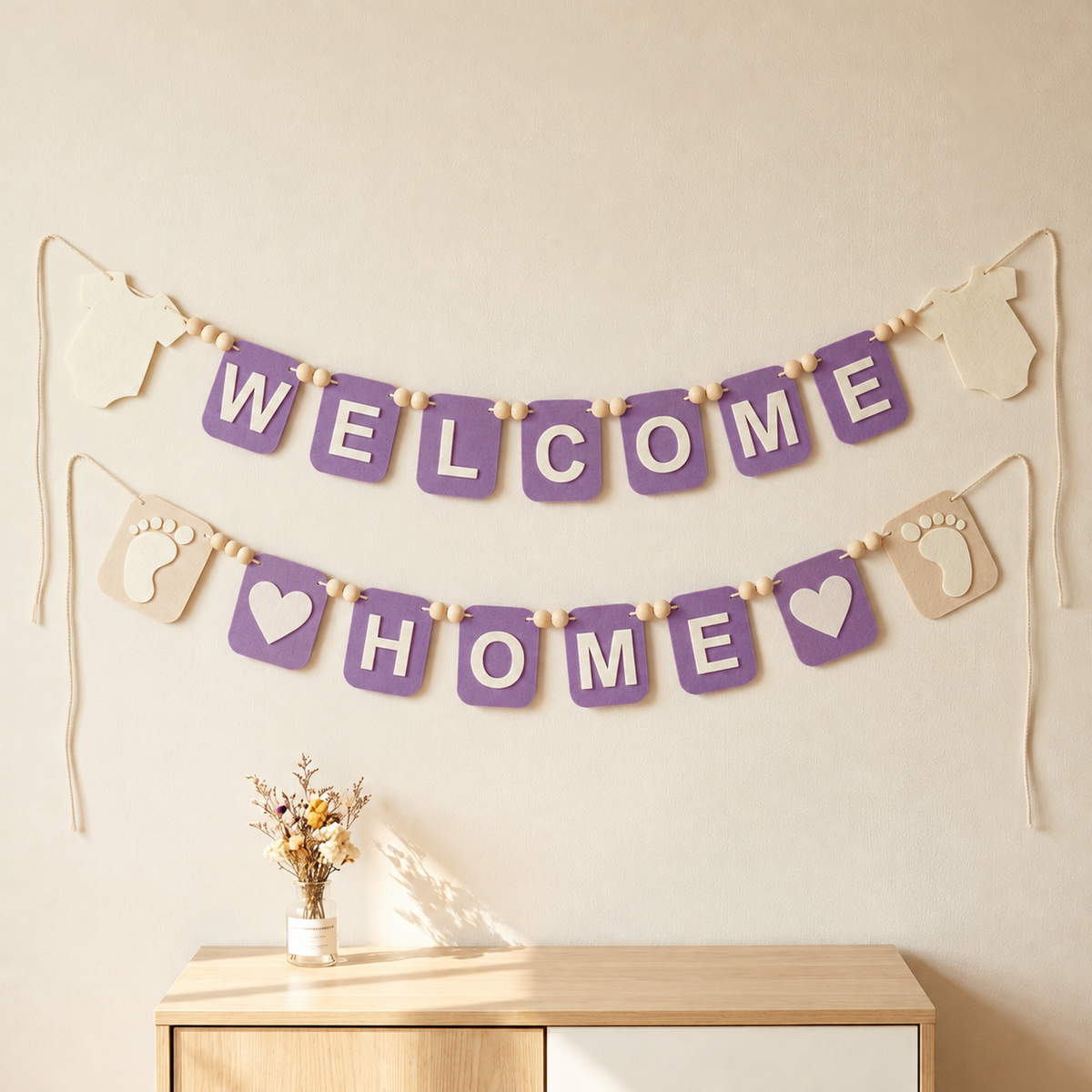 Lavender WELCOME HOME felt garland with baby bodysuit shapes, footprints and hearts