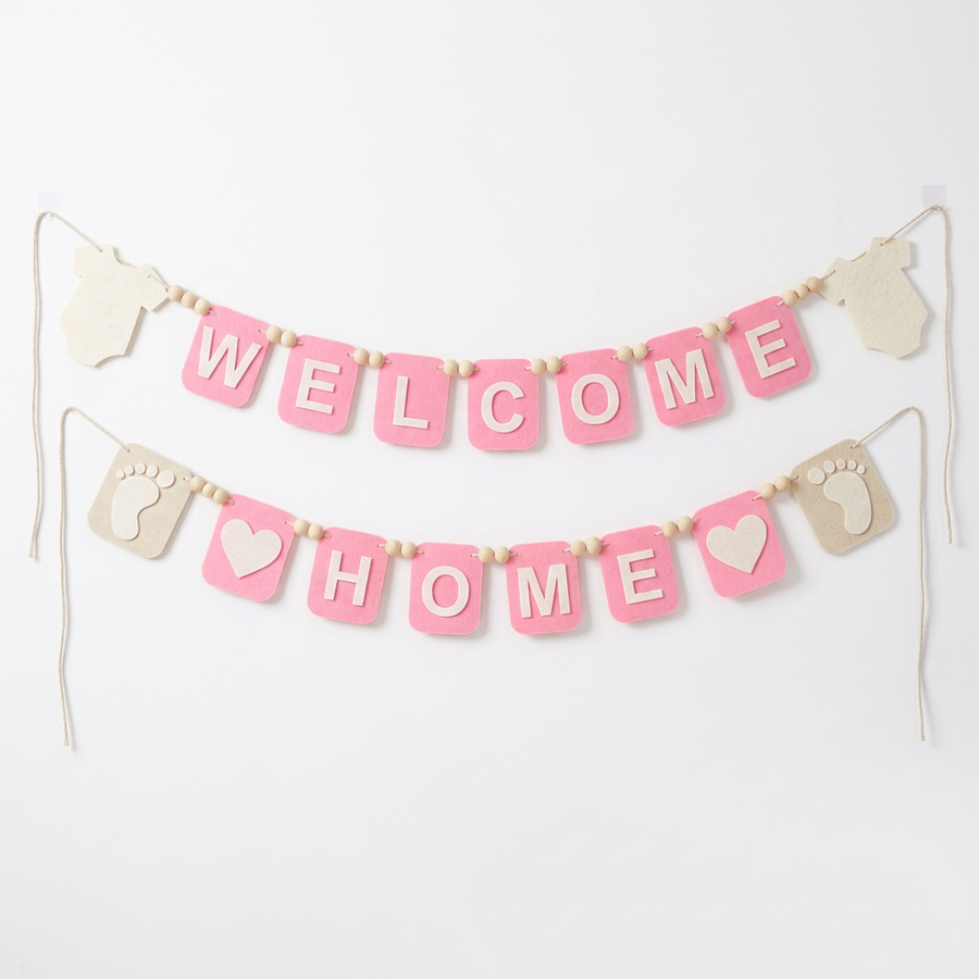 Pink WELCOME HOME felt garland with baby bodysuit shapes, footprints and hearts