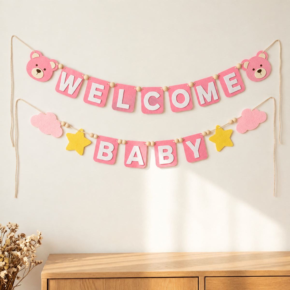 Pink WELCOME BABY felt garland with teddy bear faces, clouds and yellow stars